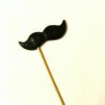 Single Black Mustache on a ..