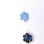 Blue garland with paper flo..