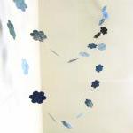 Blue garland with paper flo..